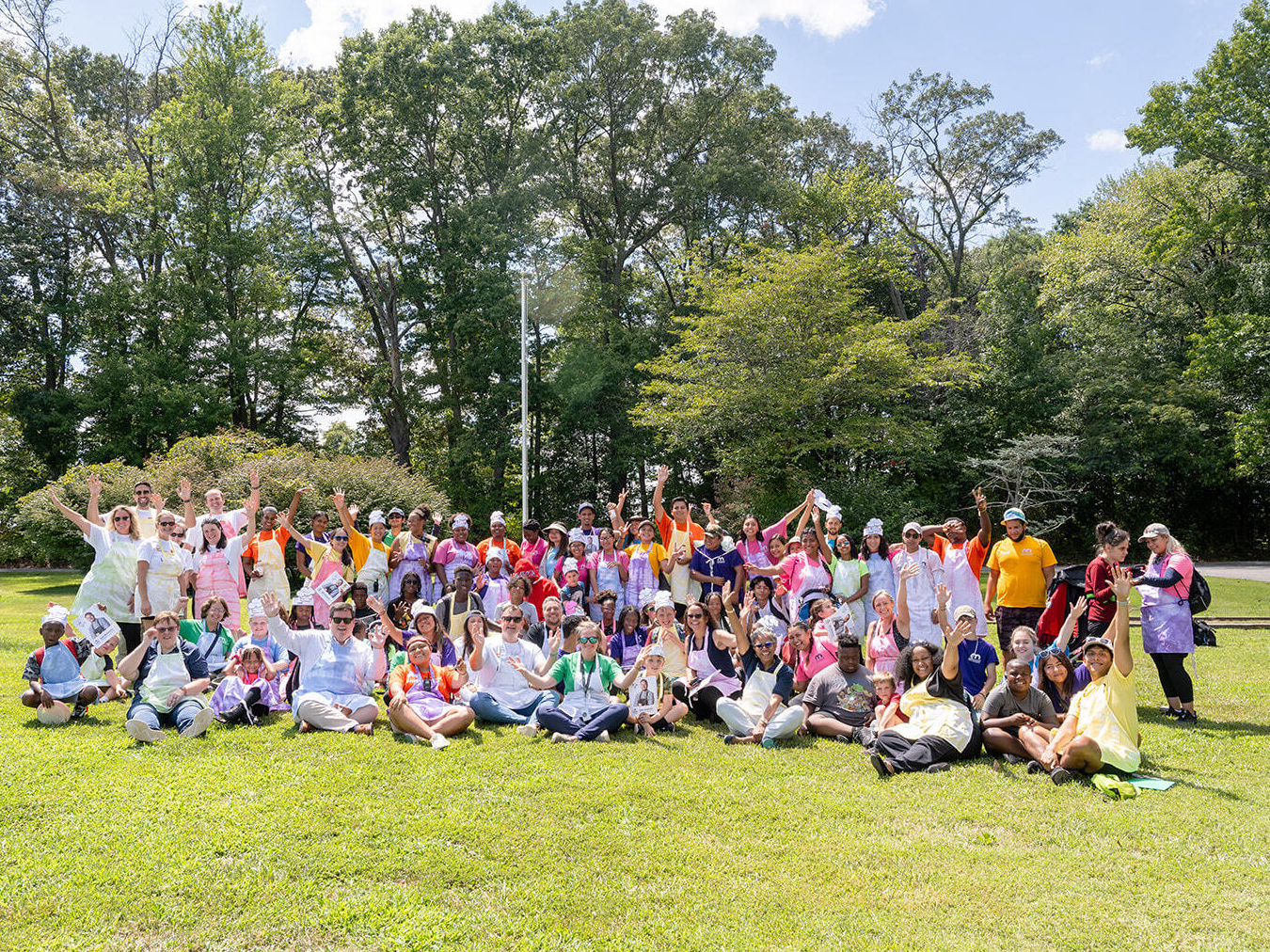 Wills Group employees gather at Melwood's Camp Accomplish for volunteer day.